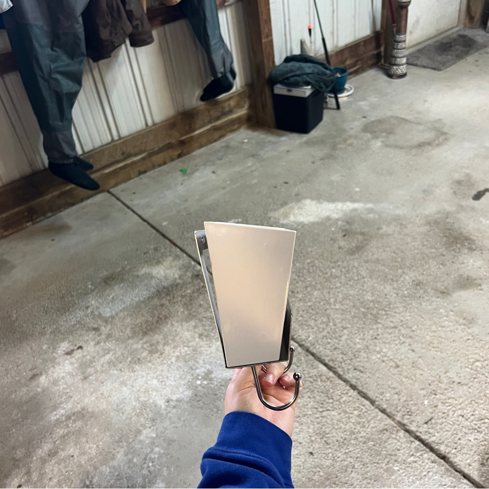 Mail wall decor for holding mail and has hooks under